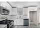 Bright kitchen with stainless steel appliances and granite countertops at 2653 Del Ridge Dr, Douglasville, GA 30135