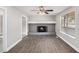 Cozy living room featuring a stone fireplace and wood-look floors at 2653 Del Ridge Dr, Douglasville, GA 30135