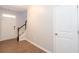 Bright foyer features wood-look floors, a staircase, and white front door and trim at 3374 Thornbridge Dr, Powder Springs, GA 30127