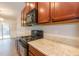 Modern kitchen with wood cabinets, stainless steel appliances and granite countertops at 3374 Thornbridge Dr, Powder Springs, GA 30127