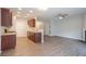 Kitchen and living room space featuring wood cabinets and granite countertops at 3374 Thornbridge Dr, Powder Springs, GA 30127