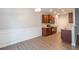 Kitchen and dining area with wood cabinets and granite countertops at 3374 Thornbridge Dr, Powder Springs, GA 30127