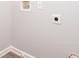 Spacious laundry room with tile flooring and washer/dryer hookups at 3374 Thornbridge Dr, Powder Springs, GA 30127