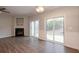 Living room with fireplace and sliding glass doors leading to a patio at 3374 Thornbridge Dr, Powder Springs, GA 30127