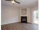 Bright living room with a fireplace and sliding glass door to the outside at 3374 Thornbridge Dr, Powder Springs, GA 30127