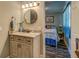 Bathroom with granite countertop vanity that opens to an adjacent bedroom at 885 Malcom Rd, Covington, GA 30014