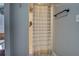 Neutral-toned bathroom features shower with patterned curtain and dark towel bar at 885 Malcom Rd, Covington, GA 30014