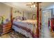 Bedroom showcasing a four-poster bed with a wood-look floor and vintage decor at 885 Malcom Rd, Covington, GA 30014