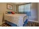 Bedroom with a white iron bed frame and blue accents, creating a calm space at 885 Malcom Rd, Covington, GA 30014