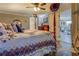 Bedroom with a four-poster bed, leading to an adjoining bathroom and sitting area at 885 Malcom Rd, Covington, GA 30014