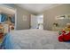 Bedroom featuring comfortable bed with laundry room and kitchen views at 885 Malcom Rd, Covington, GA 30014