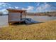 Private covered boat dock, set against a peaceful lake backdrop, perfect for boating enthusiasts at 885 Malcom Rd, Covington, GA 30014
