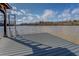Lake house dock with composite decking and a metal ladder for easy access to the water at 885 Malcom Rd, Covington, GA 30014