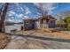 Charming home with gray siding, red roof, and lakeside views from a wooden deck on a sunny day at 885 Malcom Rd, Covington, GA 30014