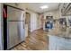 Bright kitchen featuring stainless steel appliances, granite counters, and wood-look floors that create a welcoming space at 885 Malcom Rd, Covington, GA 30014