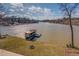 Scenic view of the lake with a private covered dock, showcasing the natural beauty and access to water activities at 885 Malcom Rd, Covington, GA 30014