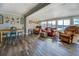 Spacious living room with lake views, a dining table, and comfortable leather seating at 885 Malcom Rd, Covington, GA 30014