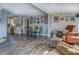 Open-concept living and dining area, accented with wood plank wall and decor at 885 Malcom Rd, Covington, GA 30014