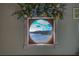A window view of the water outside with decorative wreath around the window at 885 Malcom Rd, Covington, GA 30014