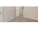 Neutral bedroom with carpeted floors, and open door way, and painted baseboards at 2239 Pinewood Dr, Decatur, GA 30032