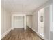 Bedroom with hardwood floors, minimalist blinds, and clean neutral paint at 2239 Pinewood Dr, Decatur, GA 30032