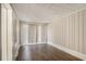 Bedroom with hardwood floors, minimalist blinds, and clean neutral paint at 2239 Pinewood Dr, Decatur, GA 30032