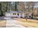 Charming brick home featuring a well-manicured lawn and a welcoming entrance at 2239 Pinewood Dr, Decatur, GA 30032