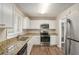 Modern kitchen featuring granite countertops, stainless steel appliances, and ample cabinetry at 2239 Pinewood Dr, Decatur, GA 30032
