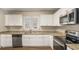 Modern kitchen featuring granite countertops, stainless steel appliances, and ample cabinetry at 2239 Pinewood Dr, Decatur, GA 30032