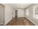 Bright living room featuring hardwood floors, large windows and ceiling fan at 2239 Pinewood Dr, Decatur, GA 30032