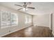 Bright living room featuring hardwood floors, large windows and ceiling fan at 2239 Pinewood Dr, Decatur, GA 30032