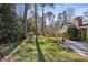 A spacious backyard with a lush lawn and mature trees, offering a private and serene outdoor setting at 860 Valleymeade Se Dr, Marietta, GA 30067