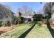 A lush green backyard with mature trees and a patio provides a serene outdoor space at 860 Valleymeade Se Dr, Marietta, GA 30067