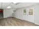 The basement features luxury vinyl plank floors, white walls, and a double door to the exterior at 860 Valleymeade Se Dr, Marietta, GA 30067