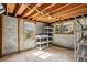 This unfinished basement space features exposed beams, bare concrete walls, and 2 windows at 860 Valleymeade Se Dr, Marietta, GA 30067