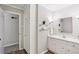 Bright bathroom featuring white vanity and storage with view into second bathroom at 860 Valleymeade Se Dr, Marietta, GA 30067