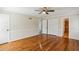 Bedroom featuring hardwood floors, ceiling fan, walk-in closet, and entry to the en-suite bathroom at 860 Valleymeade Se Dr, Marietta, GA 30067