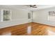 Bright bedroom with hardwood floors, white trim, and two windows offering natural light at 860 Valleymeade Se Dr, Marietta, GA 30067
