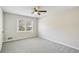 Spacious bedroom with neutral walls, gray carpet, and natural light from two windows at 860 Valleymeade Se Dr, Marietta, GA 30067