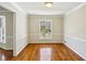 Dining room with wood floors, neutral walls, large window and classic trim at 860 Valleymeade Se Dr, Marietta, GA 30067
