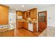 Kitchen features wooden cabinets, stainless steel appliances, tile backsplash and wood floor at 860 Valleymeade Se Dr, Marietta, GA 30067