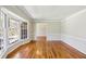 Bright living room featuring hardwood floors, large bay window, and neutral paint at 860 Valleymeade Se Dr, Marietta, GA 30067