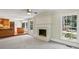 Open-concept living room with brick fireplace and view into the kitchen at 860 Valleymeade Se Dr, Marietta, GA 30067