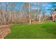 Beautiful green backyard with mature trees and a cozy hammock area at 1293 Wynford Colony Sw, Marietta, GA 30064