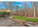 Expansive backyard with patio, seating, shade, and a lush lawn perfect for entertainment at 1293 Wynford Colony Sw, Marietta, GA 30064