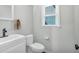 Bathroom with white cabinets, white toilet, and neutral paint color at 1293 Wynford Colony Sw, Marietta, GA 30064