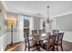 Elegant dining area boasting hardwood floors, a chandelier, and a serene ambiance at 1293 Wynford Colony Sw, Marietta, GA 30064