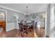 Formal dining room with hardwood floors and views of the outdoor landscape at 1293 Wynford Colony Sw, Marietta, GA 30064