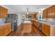Spacious kitchen features wood floors, stainless steel appliances and a kitchen island at 1293 Wynford Colony Sw, Marietta, GA 30064