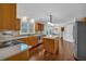 Well-lit kitchen featuring granite countertops, stainless steel appliances, and hardwood flooring at 1293 Wynford Colony Sw, Marietta, GA 30064